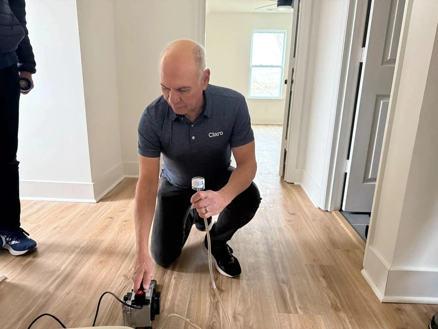 Technician conducting indoor air quality testing to identify potential mold problems